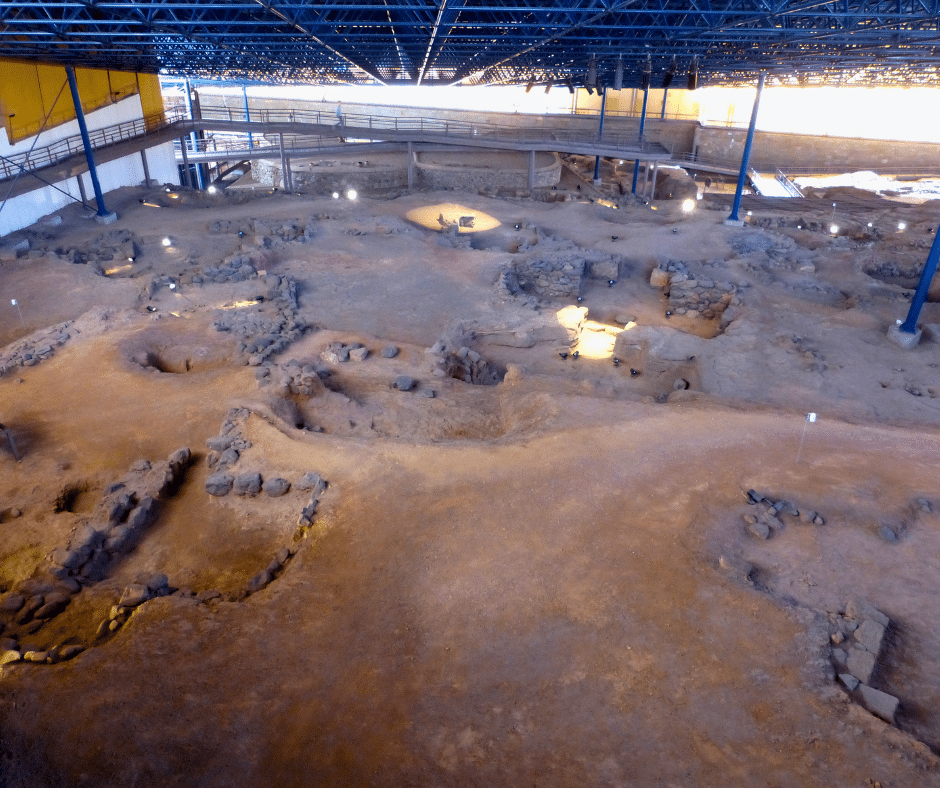 Cueva Pintada Archaeological Park in Gáldar, raised walkways over a reconstructed pre-Hispanic village with the painted chamber’s geometric wall motifs, north Gran Canaria.